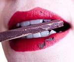 chocolate in woman's teeth